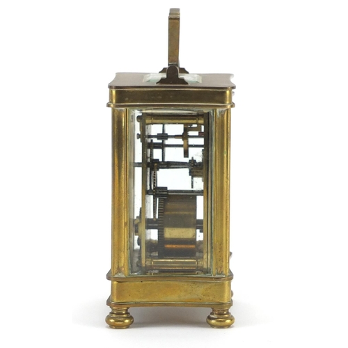 2134 - Brass cased carriage clock with bevelled glass sides and enamelled dial, 12cm high