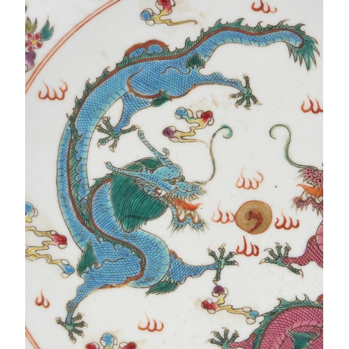 617 - Chinese porcelain shallow dish, hand painted in the famille rose palette with objects and two dragon... 