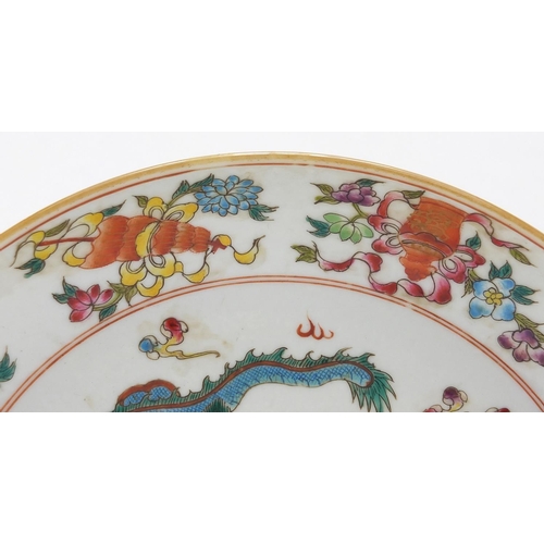 617 - Chinese porcelain shallow dish, hand painted in the famille rose palette with objects and two dragon... 