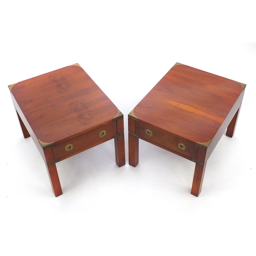 31 - Pair of yew campaign style coffee tables, each fitted with a drawer, 42cm H x 46cm W x 58cm D
