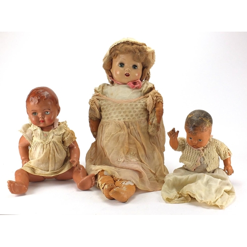 200 - Three vintage dolls, the largest  68cm in length