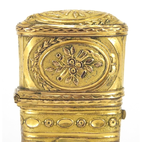 4 - 18th century gilt repoussé etui decorated with panels of flowers, the fitted interior housing implem... 