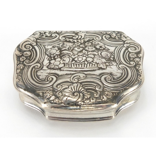 37 - 18th century continental unmarked silver snuff box with gilt interior, the hinged lid cast with flow... 