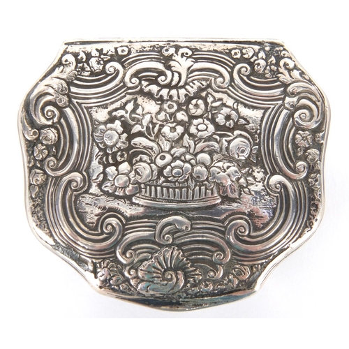 37 - 18th century continental unmarked silver snuff box with gilt interior, the hinged lid cast with flow... 