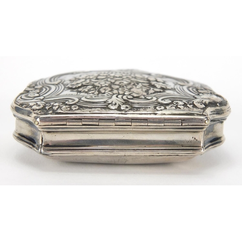 37 - 18th century continental unmarked silver snuff box with gilt interior, the hinged lid cast with flow... 