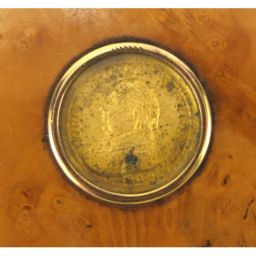 30 - 19th century circular burr yew snuff box, the lid inset with a Louis XVIII gold coloured coin, 6.5cm... 