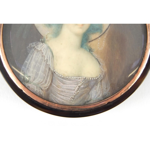 9 - 18th century circular tortoiseshell portrait snuff box with gold coloured mount, the lid hand painte... 