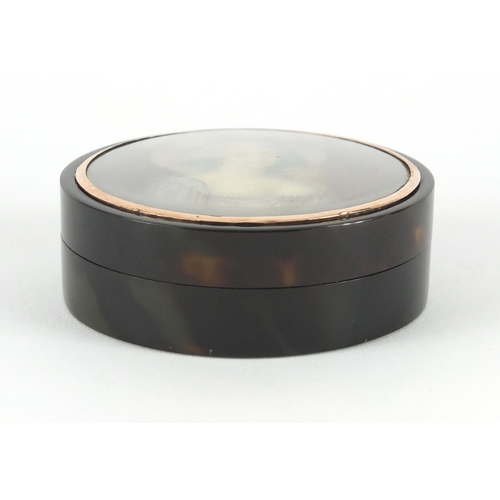 9 - 18th century circular tortoiseshell portrait snuff box with gold coloured mount, the lid hand painte... 