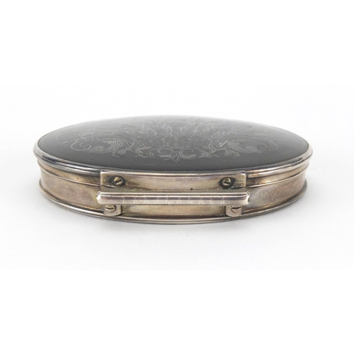 21 - 18th century oval silver and tortoiseshell snuff box, the hinged tortoiseshell pique work lid decora... 