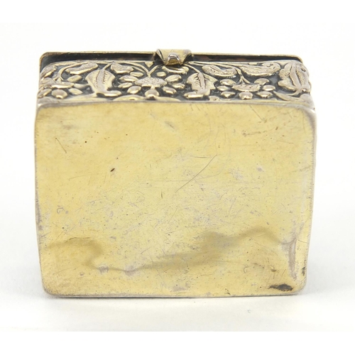 55 - 18th century rectangular unmarked silver and enamel pill box embossed with flowers, the hinged green... 