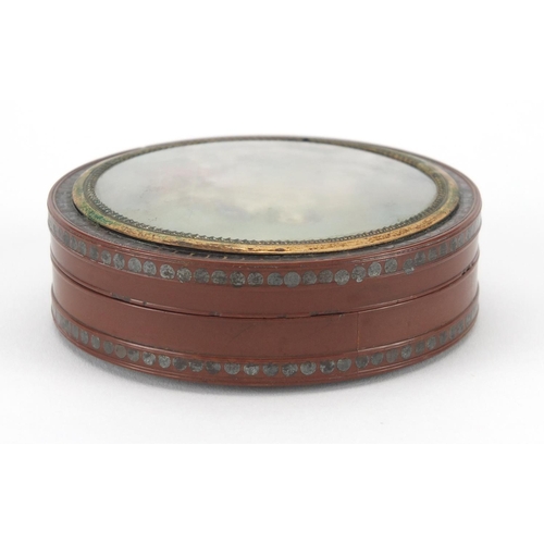 7 - 18th century circular lacquer snuff box with gold coloured mount, metal studwork and tortoiseshell l... 