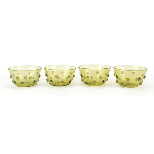 936 - Four Arts & Crafts green glass finger bowls, each 13.5cm in diameter