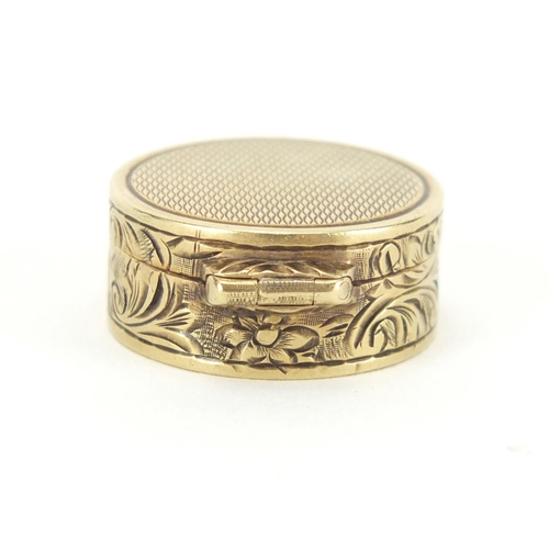 56 - Continental 14ct gold pill box with floral chased decoration, impressed mark around the inside rim, ... 