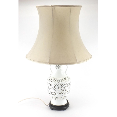 2133 - Chinese blanc de chine porcelain lamp base with silk lined shade, pierced and decorated with flowers... 