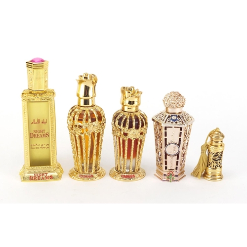 2075 - Five bottles of Al Haramain perfume, each bottle with an ornate case