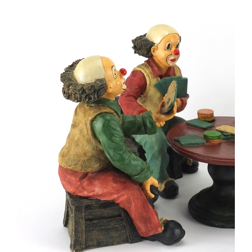 2222 - Hand painted set of four clowns playing cards around a table, the largest 24cm high