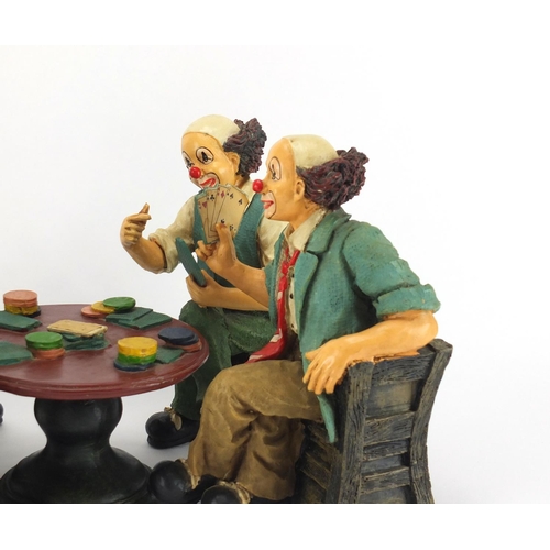 2222 - Hand painted set of four clowns playing cards around a table, the largest 24cm high