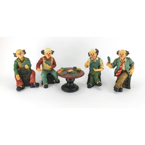 2222 - Hand painted set of four clowns playing cards around a table, the largest 24cm high