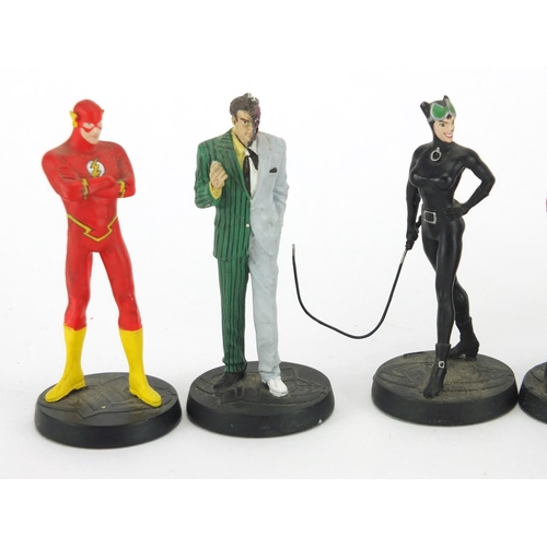 2297 - Nine hand painted Super hero's DC Comic figures including Batman and The Joker, each approximately 1... 