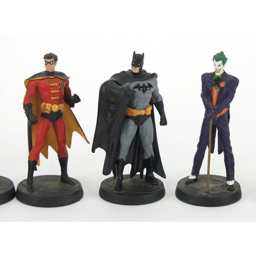 2297 - Nine hand painted Super hero's DC Comic figures including Batman and The Joker, each approximately 1... 