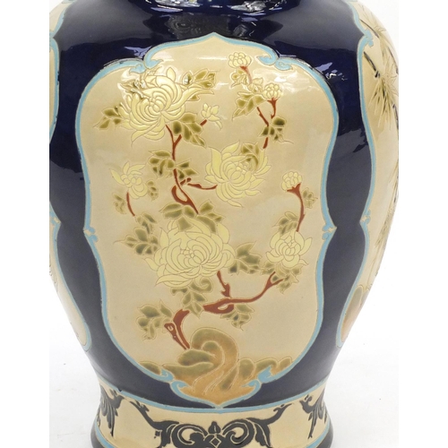 2047 - Large floor standing Chinese porcelain vase, hand painted with panels of flowers, 69cm high