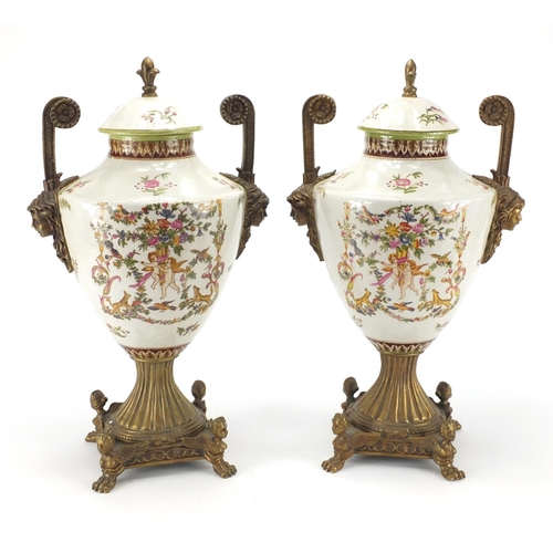 2230 - Pair of classical design porcelain vases and covers with metal mounts and twin handles of urn form, ... 