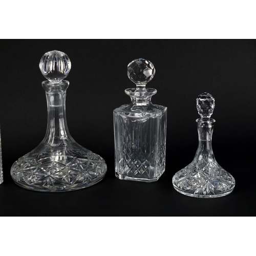 2107 - Five cut glass decanters including three ship design and an Edinburgh Crystal example with faceted s... 