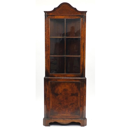 2036 - Queen Anne style burr walnut standing corner cabinet, with glazed door enclosing two shelves above a... 