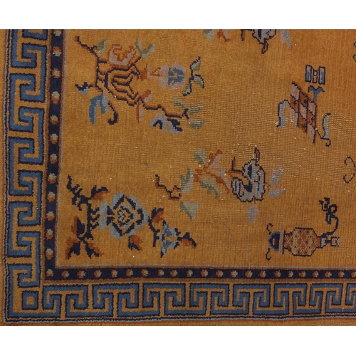 2018 - Pair of 1920's Chinese rugs, each having a bat, flower and vase design onto a yellow ground, each 20... 