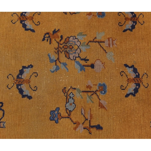 2018 - Pair of 1920's Chinese rugs, each having a bat, flower and vase design onto a yellow ground, each 20... 