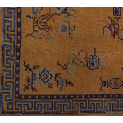 2018 - Pair of 1920's Chinese rugs, each having a bat, flower and vase design onto a yellow ground, each 20... 