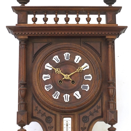 2053 - Carved wooden Black forest wall clock with thermometer and barometer, 90cm in length