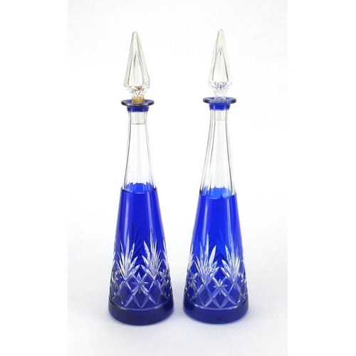 2231 - Large pair of blue flashed cut glass decanters, of tapering form, each approximately 42.5cm high