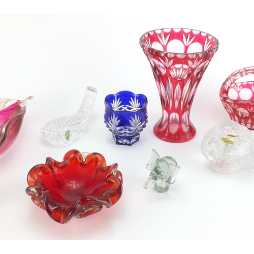 2302 - Colourful glassware including flashed cut glass vases, Caithness Bluebell paperweight and a Waterfor... 