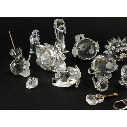 2299 - Collection of mostly Swarovski Crystal animals including hedgehog, apple trinket and penguin, the la... 