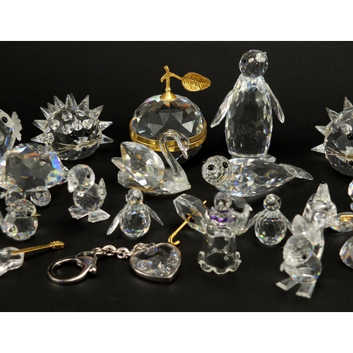 2299 - Collection of mostly Swarovski Crystal animals including hedgehog, apple trinket and penguin, the la... 