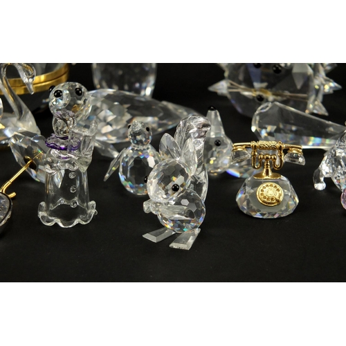 2299 - Collection of mostly Swarovski Crystal animals including hedgehog, apple trinket and penguin, the la... 