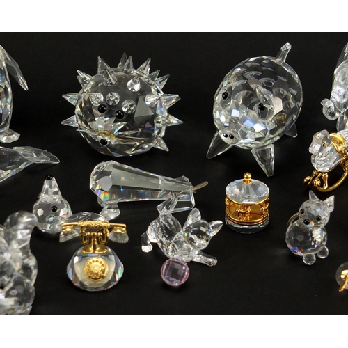 2299 - Collection of mostly Swarovski Crystal animals including hedgehog, apple trinket and penguin, the la... 