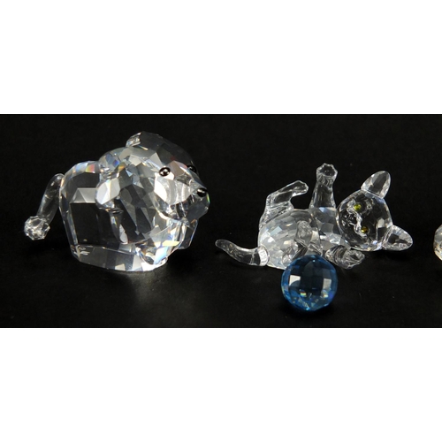 2301 - Four Swarovski Crystal animals including a cat and duck, all boxed, the largest 5.5cm wide