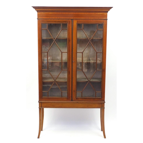 2023 - Edwardian inlaid mahogany bookcase, fitted with a pair of astragal glazed doors enclosing three shel... 