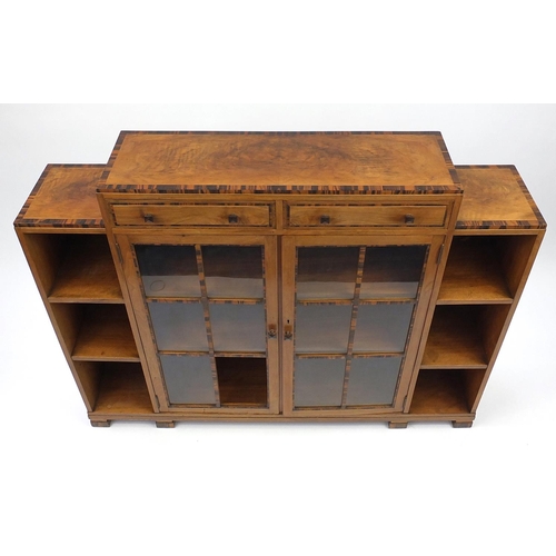 2004 - Art Deco banded walnut bookcase, fitted with a pair of glazed doors and open shelves, 100cm H x 125.... 