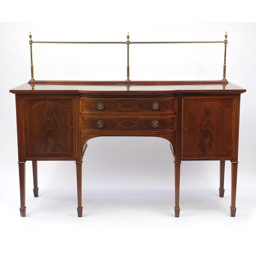 2043 - Late Victorian inlaid mahogany sideboard with brass backrail and a pair of bow fronted cupboard door... 