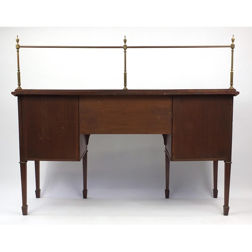 2043 - Late Victorian inlaid mahogany sideboard with brass backrail and a pair of bow fronted cupboard door... 