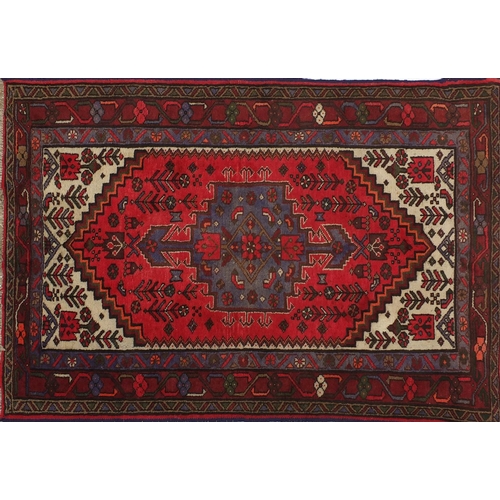 2032 - Rectangular Persian rug having an all over stylised floral design, 155cm x 102cm