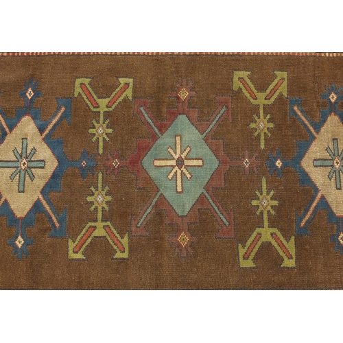 2005 - Rectangular Turkish rug having a stylised flower head design, 186cm x 125cm