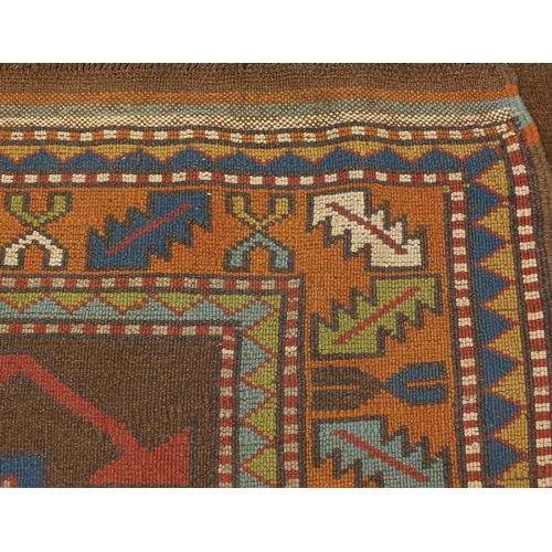 2005 - Rectangular Turkish rug having a stylised flower head design, 186cm x 125cm