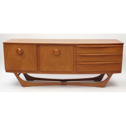 2015 - Vintage teak Beautility sideboard, fitted with three drawers and a pair of cupboard doors, 74cm H x ... 