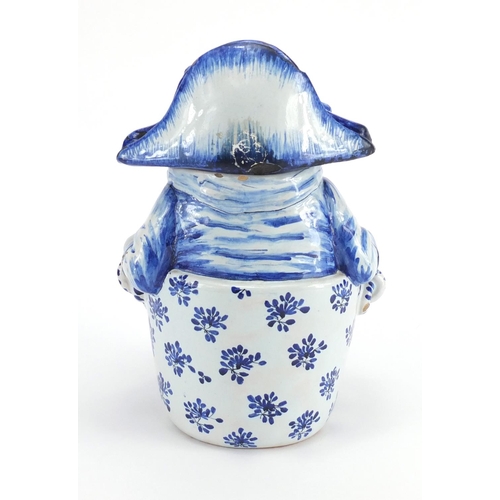 2242 - Delft blue and white pottery figural jar and cover, 27cm high