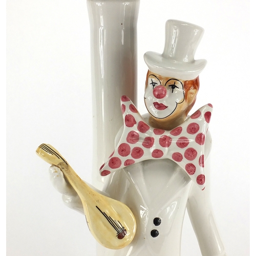 2228 - Italian clown design porcelain table lamp with globular glass shade, 60cm high