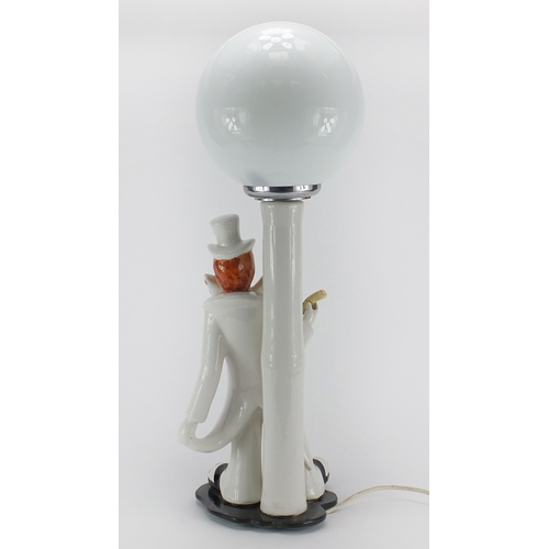 2228 - Italian clown design porcelain table lamp with globular glass shade, 60cm high